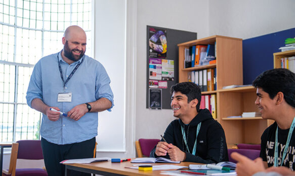 sbc-tutor-and-students-smiling-in-class