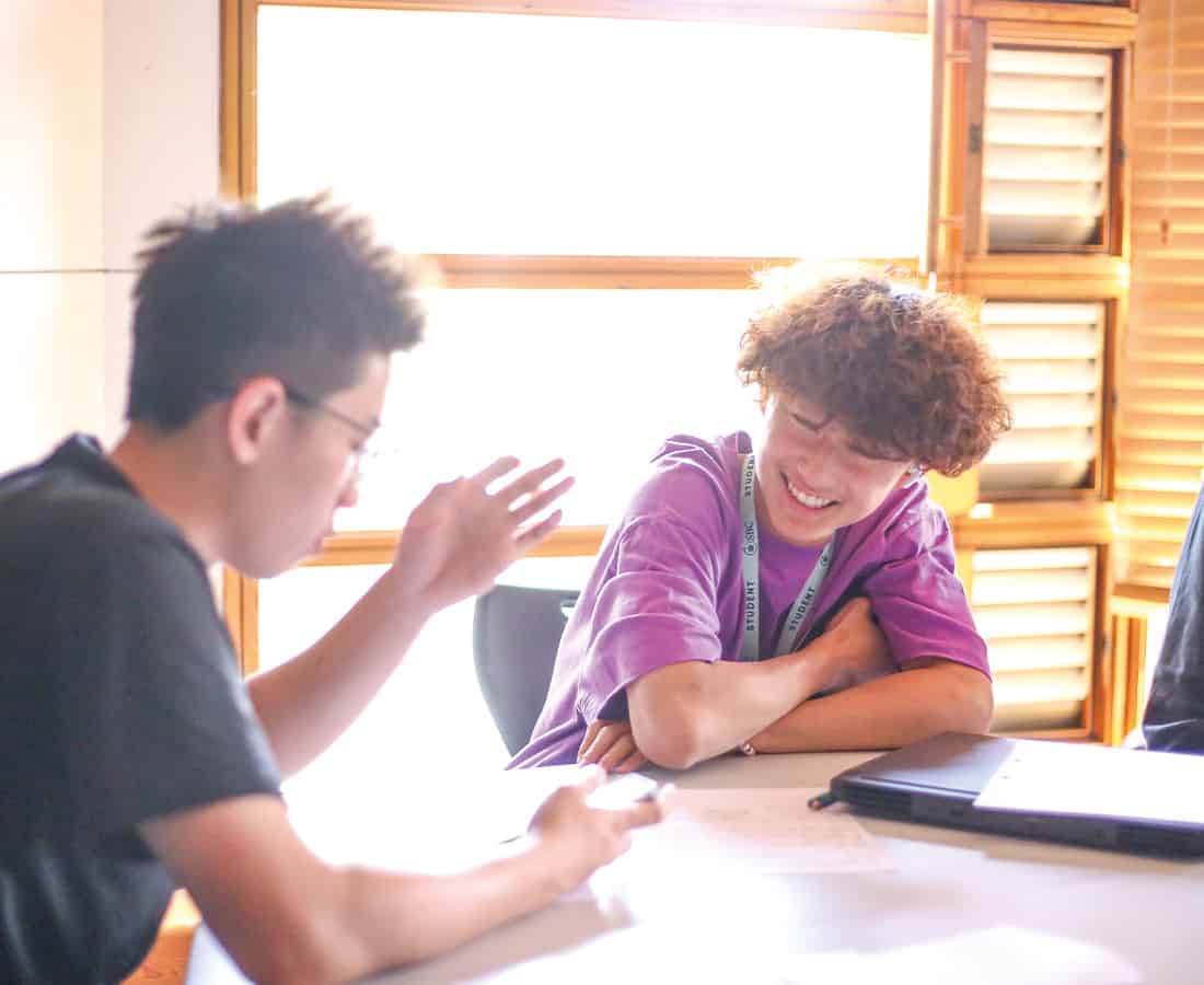 two-male-summer-school-students-chatting