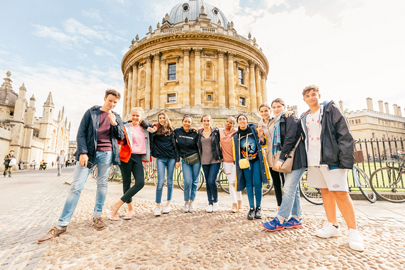 students stood together infront of oxford radcliffe building lowres