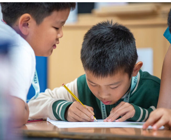 young-sbc-student-working-in-class