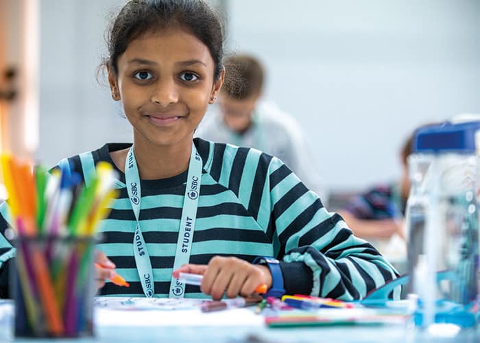 young-summer-student-smiling-in-art-class