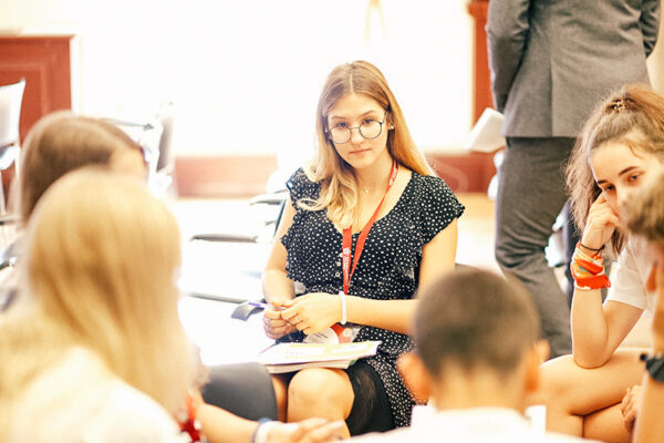 oxford college students sat together in class discussing work