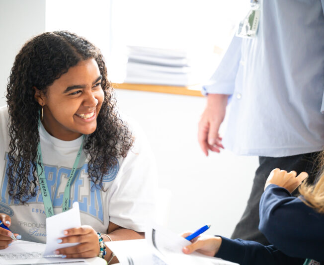 Young diverse students enjoying a fun and engaging summer boarding course, learning and socialising. Perfect for kids and teenagers seeking a memorable summer experience with educational activities.
