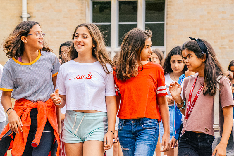 female students walking together at summer school lowres