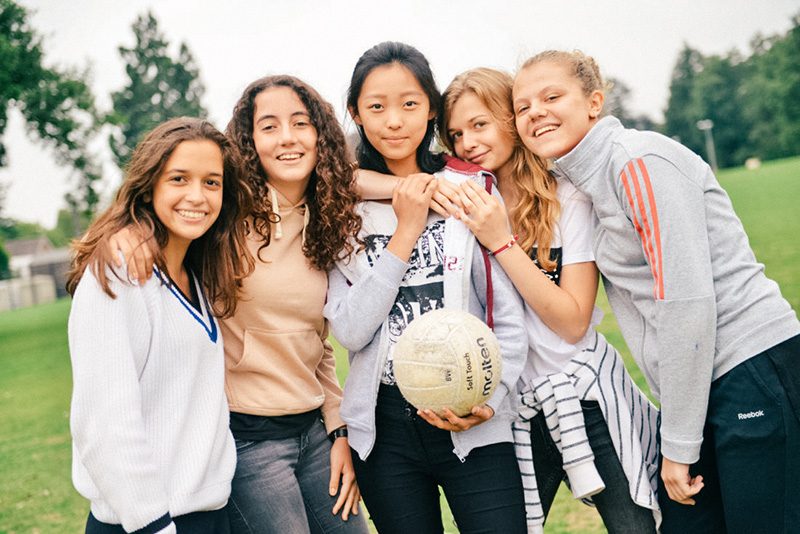 headington students playing outside with a ball lowres