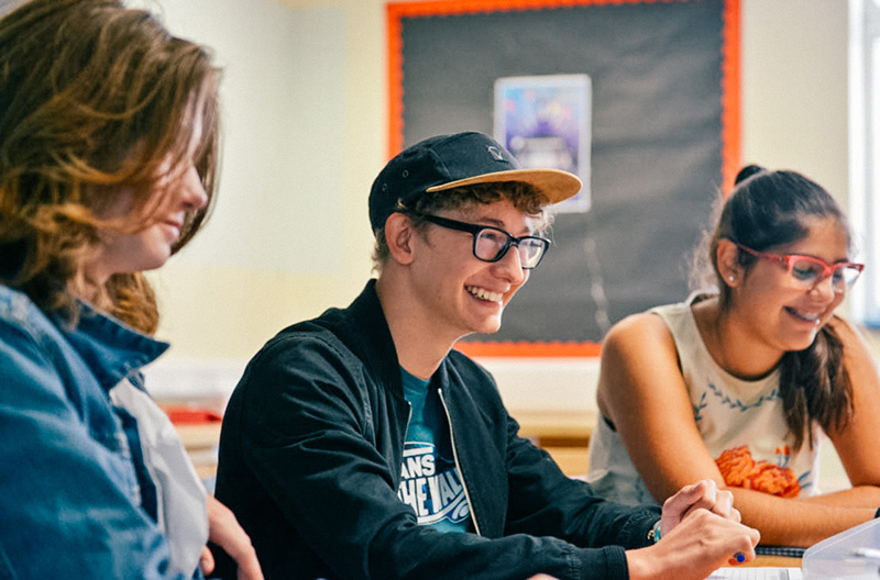 paragraph writing prompts grade 8 laughing and smiling students in class lowres