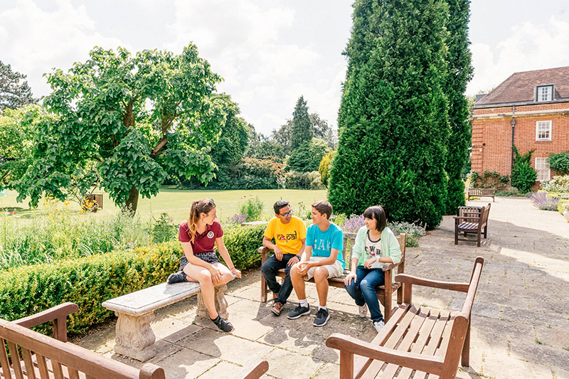 sbc staff member talking to students at oxford college lowres