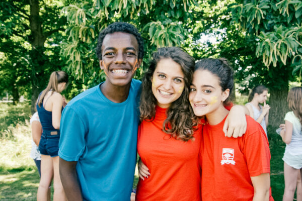 sbc students outside with their arms around each other