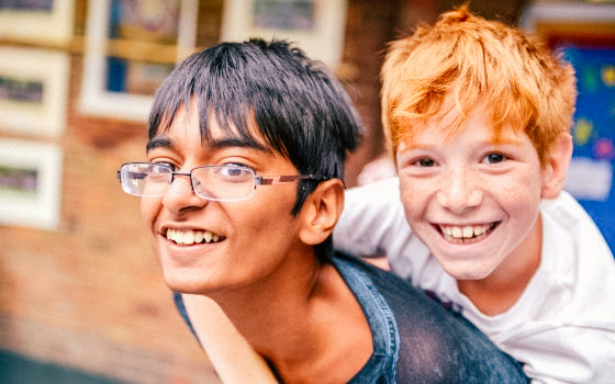 two male students outside playing