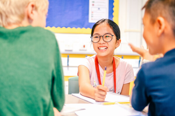 young sbc student smiling in class