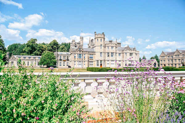 SBC Canford grounds and building in a scenic shot with flowers surrounding it