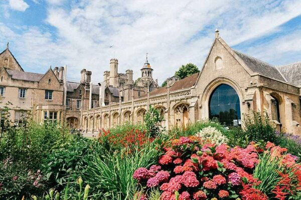SBC Canford grounds with flowers and bushes infront of the building