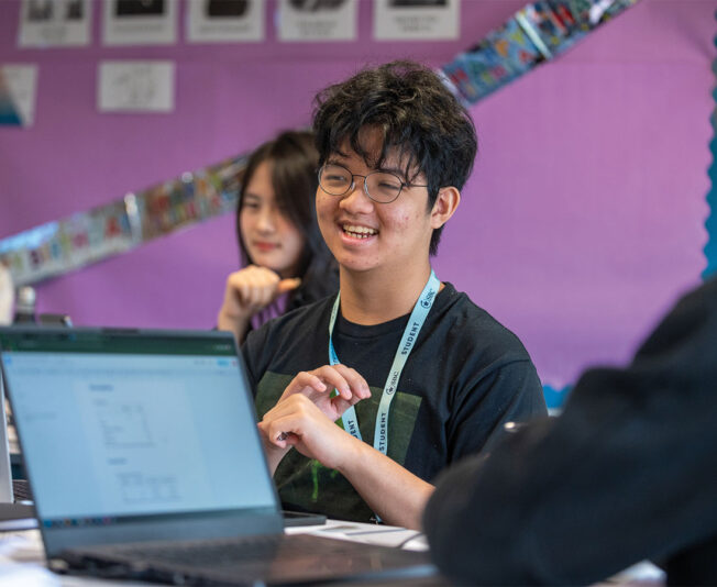 Happy-cambridge-business-summer-school-student-smiling-in-class