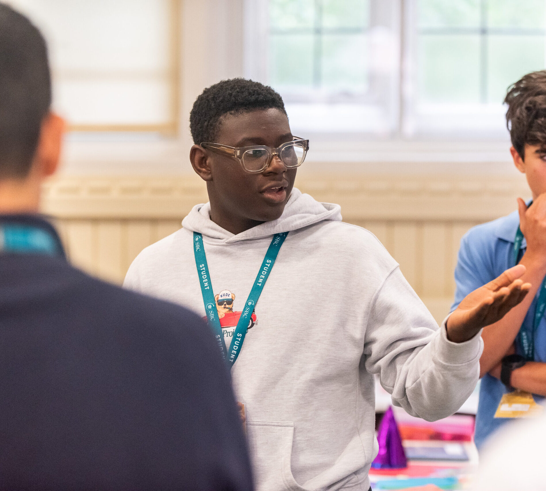 Engaging student participating in classroom activity during summer boarding courses.