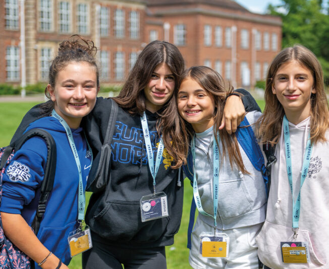 Headington-girls-arms-around-each-other-in-front-of-school