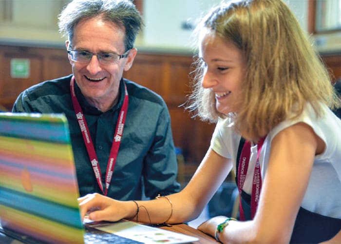 student-and-teacher-working-on-laptop