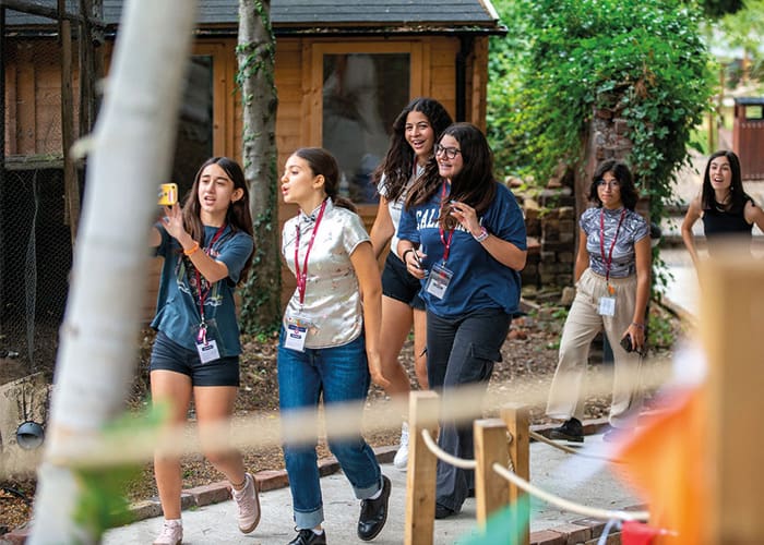 summer-school-friends-taking-photos-in-woods