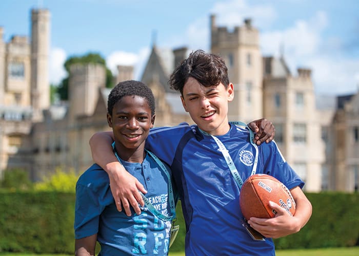 two-boys-holding-rugby-ball-canford-school
