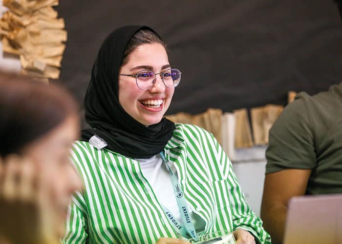 Student laughing at Cambridge College Summer sedchool.