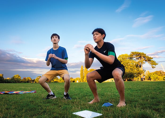 Two male students doing exercise for social activites at Oxford College