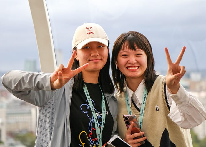 Cambridge College students smiling with London background UK