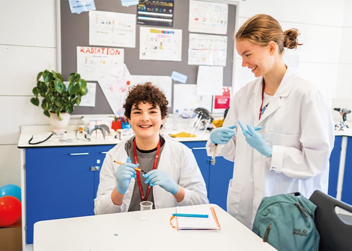 SBC-Cambridge-college-students-smiling-in-lab-coats-medicine-class