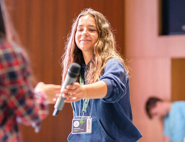 SBC-Science-female-student-taking-microphone