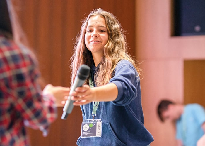 SBC-Science-female-student-taking-microphone