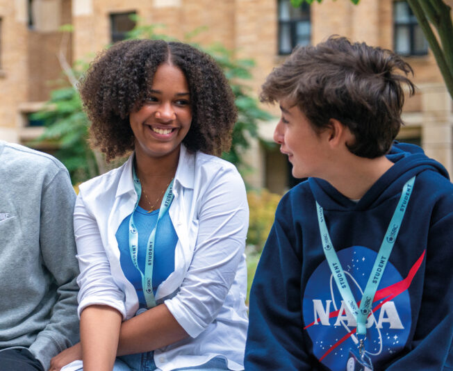 Smiling female student with two other students at Oxford College Summer Boarding Courses