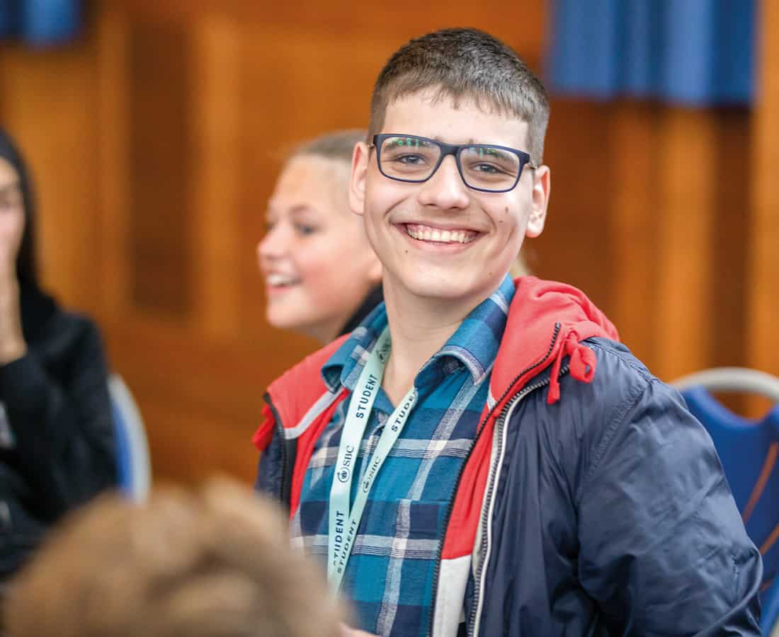 Smiling-french-UK-summer-school-student-in-glasses