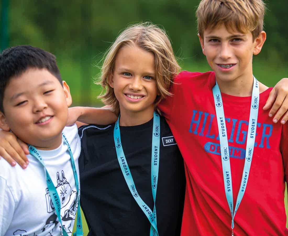 Three boys smiling at Twyford Summer School UK