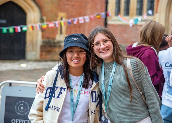 Two-SBC-eton-students-smiling-in-front-of-school