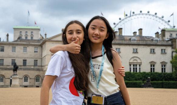 SBC Canford female students stood together and smiling on an excurision