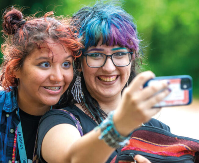 summer-boarding-school-students-smiling-taking-selfie.