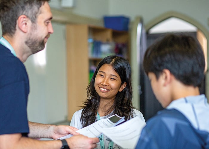 teacher-with-students-smiling-at-eton