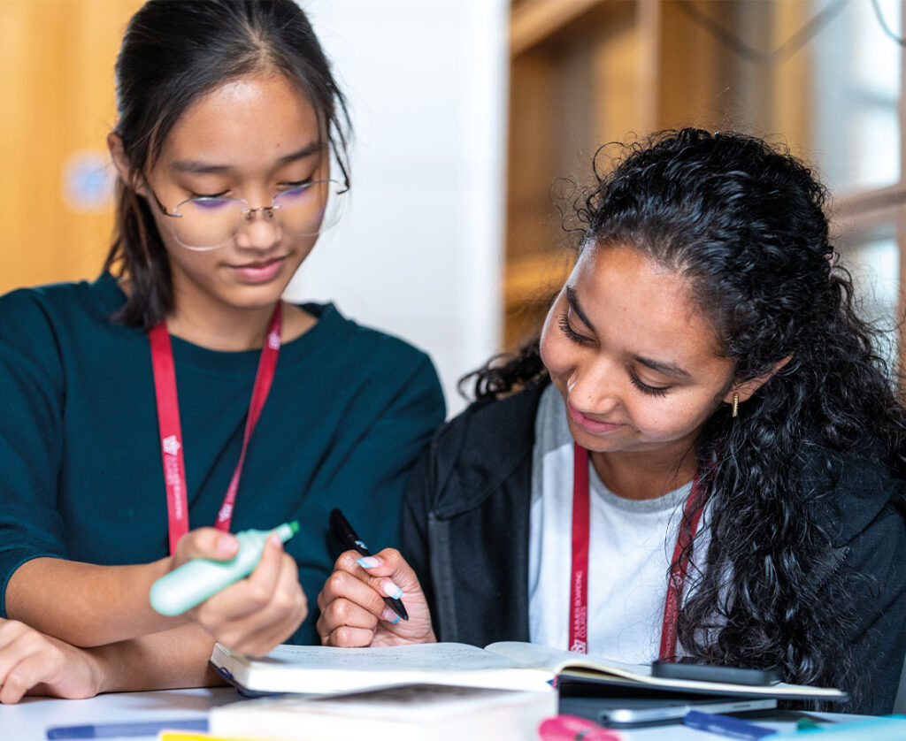 two-students-writing-with-highlighters