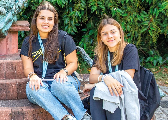 two-eton-students-sat-on-steps