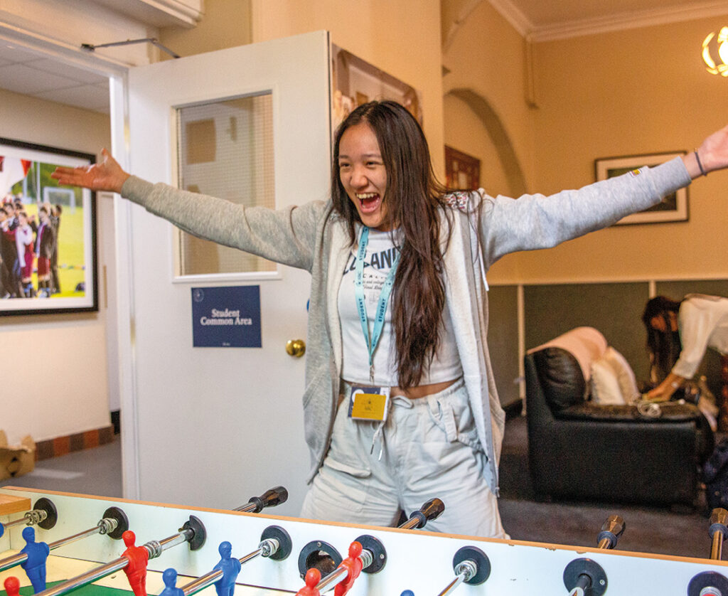 Female-Student-Playing-Foosball-at-SBC-Eton-College-Summer-School