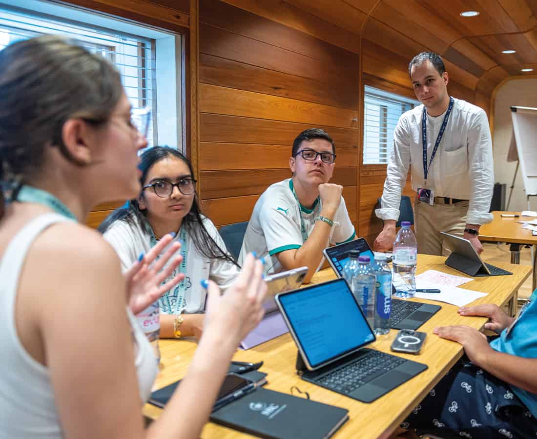 Oxford College Summer Boarding Courses students having a debate with a teacher in the classroom