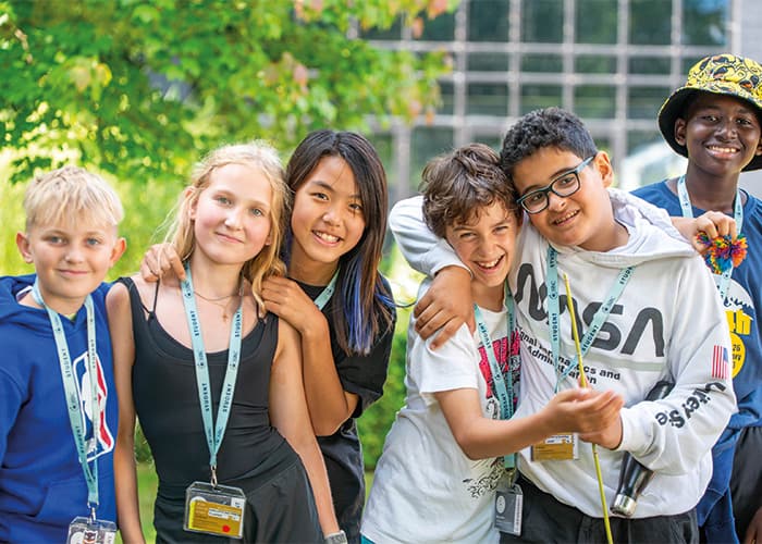 SBC-Canford-students-smiling-arms-around-eachothe