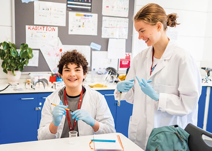 SBC-Headington-future-doctors-wearing-lab-coats-smililng