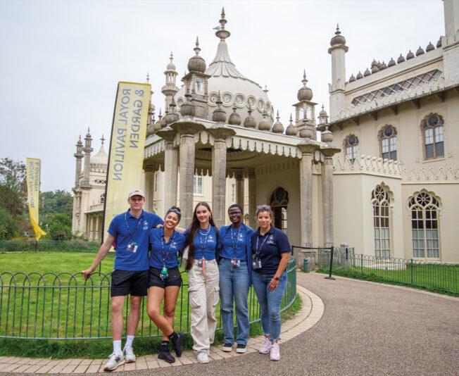 Staff stood together smiling on an excurisions with Summer Boarding Courses