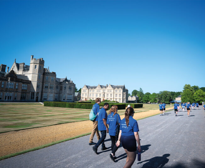 Summer Boarding Courses staff walking in the grounds of SBC Canford