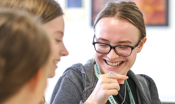 Two-SBC-Cambridge-college-students-smiling-in-summer-school-lesson