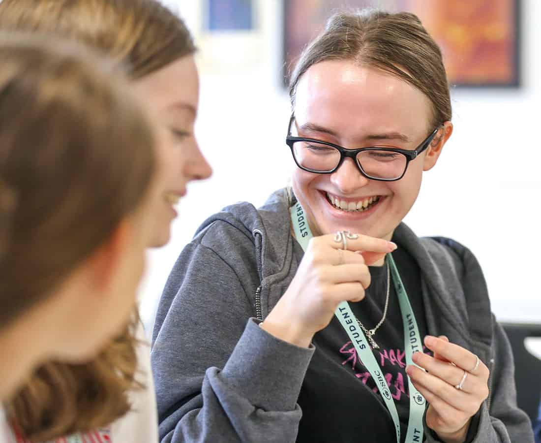 Two-SBC-Cambridge-college-students-smiling-in-summer-school-lesson