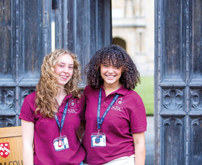 Two female Summer Boarding Courses staff members stood in a historic part of Oxford
