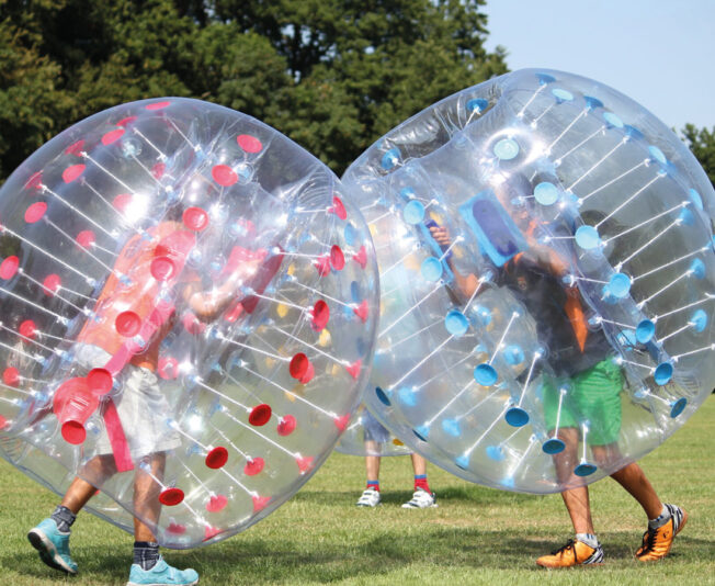 Two students having fun outside at Day Camp by Summer Boarding Courses