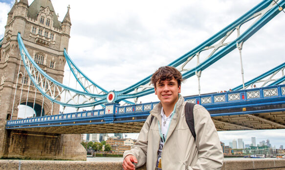 male-student-outside-Tower-Bridge-on-an-Excursion-with-SBC-at-Eton-College-Summer-School