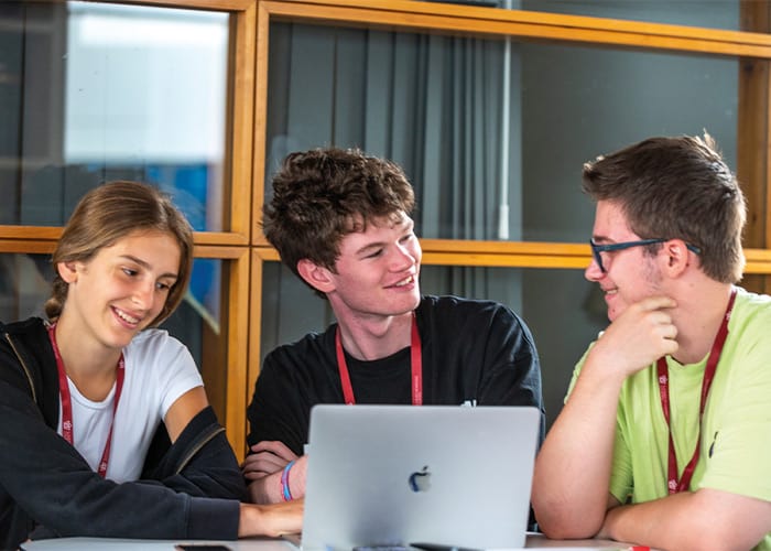 three-sbc-students-using-laptop