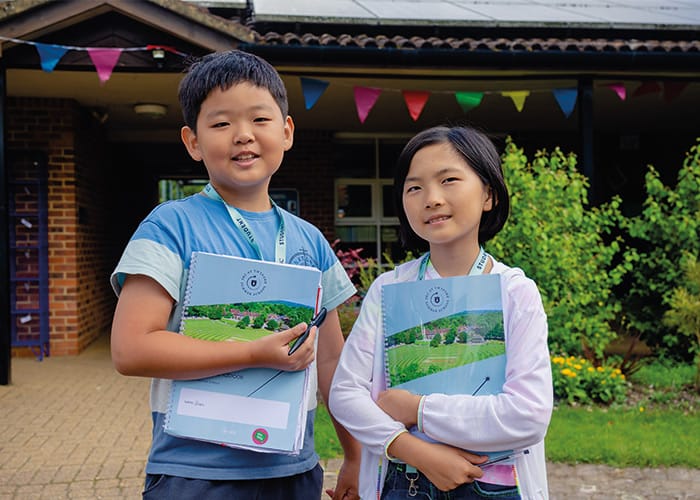 two-day-camp-students-smiling-holding-books